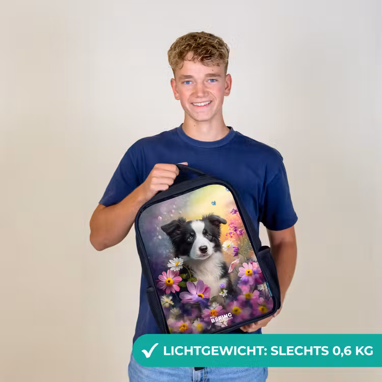 zwart witte puppy tussen kleurrijke bloemen Rugzak - Zwart middel -sfeer7_NL